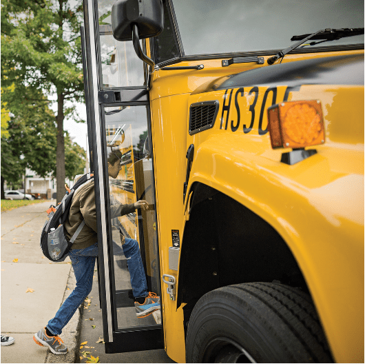 Student boarding a propane autogas school bus